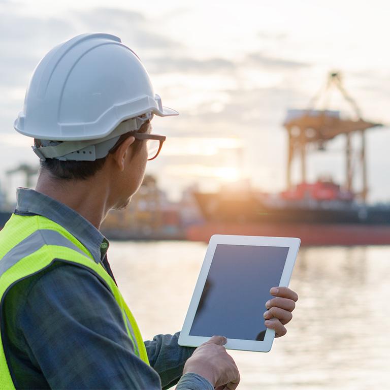 man at port with ipad