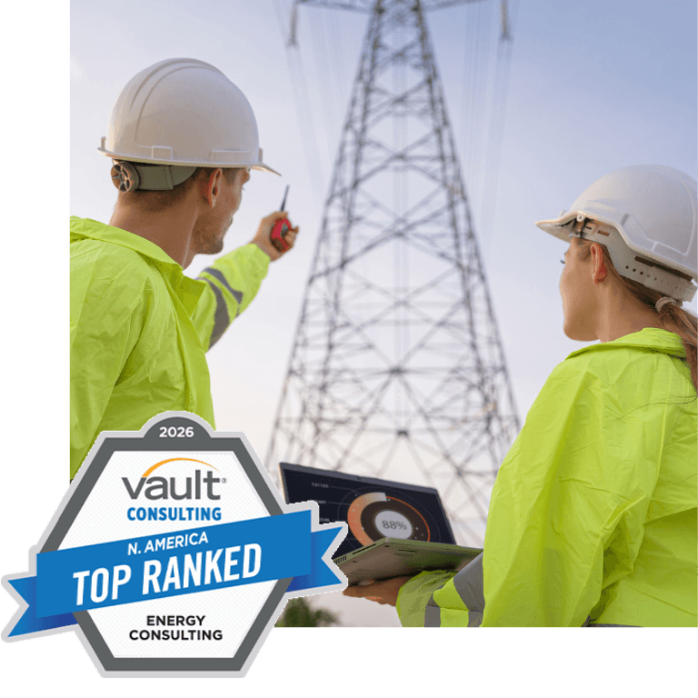 people in reflective gear and hardhats pointing at an electrical tower with a vault top energy consultants award badge in the bottom corner