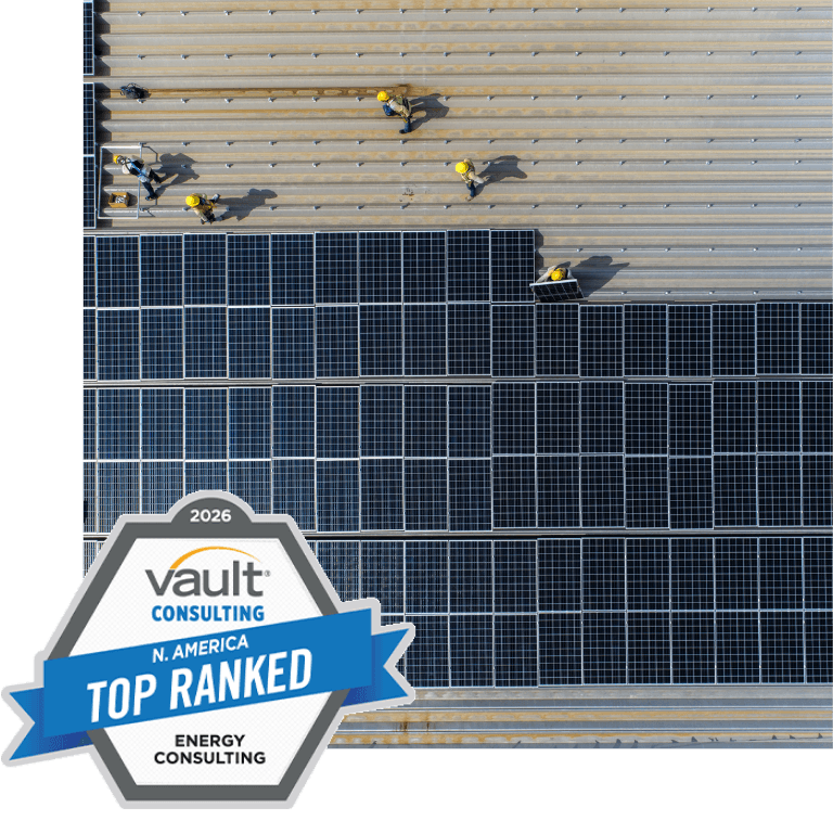 image of people working on solar panels with vault top energy consulting award logo in foreground