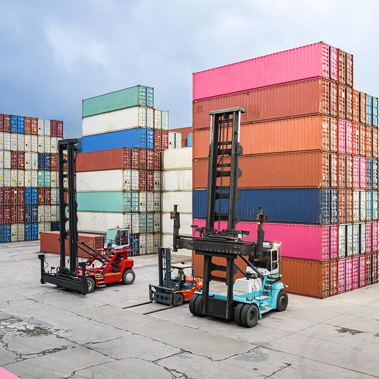 shipping containers stacked at shipping yard
