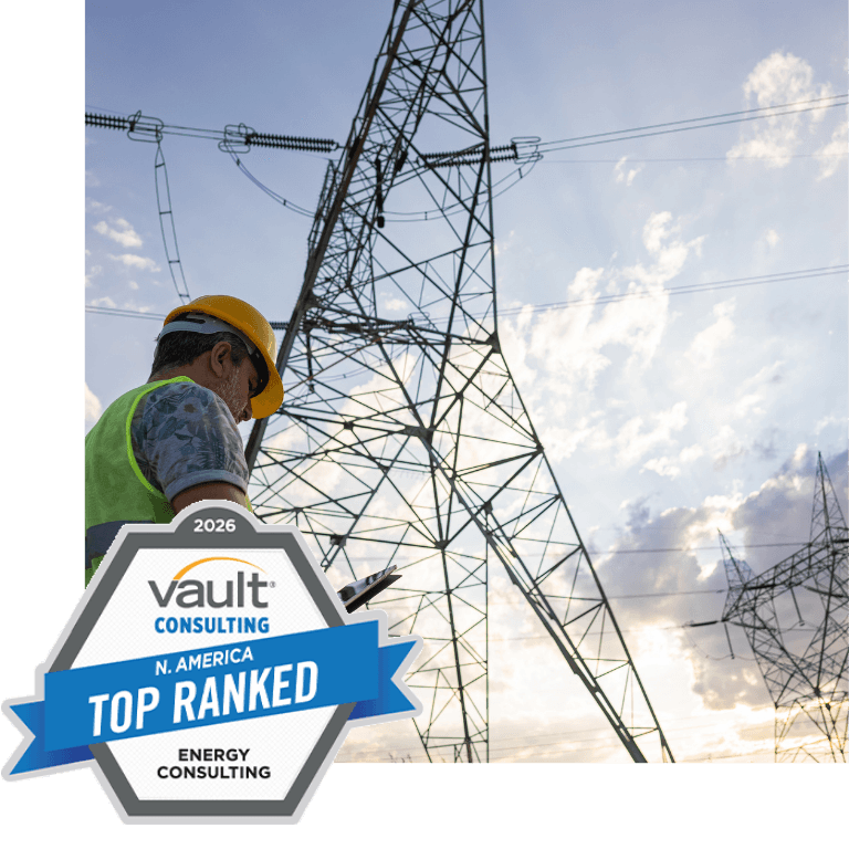image of man in front of electrical tower with vault top energy consulting award logo in foreground