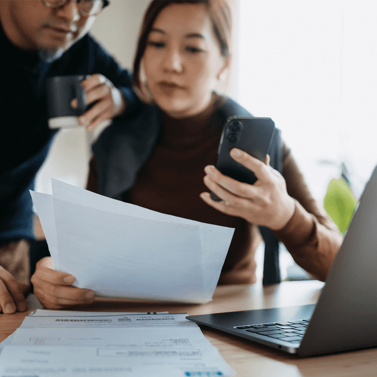 Coworkers examining a sheet of paper