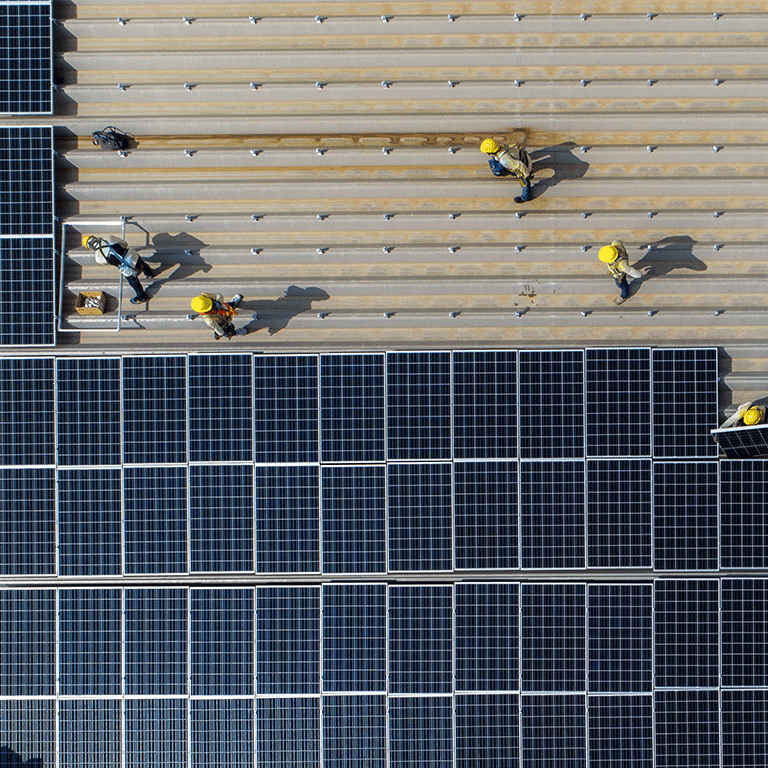 people installing solar panels