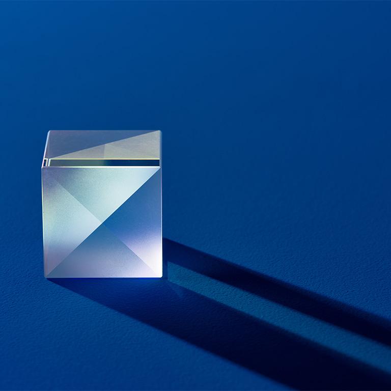 transparent cube on blue background