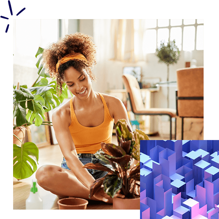 Woman sitting and tending to a plant