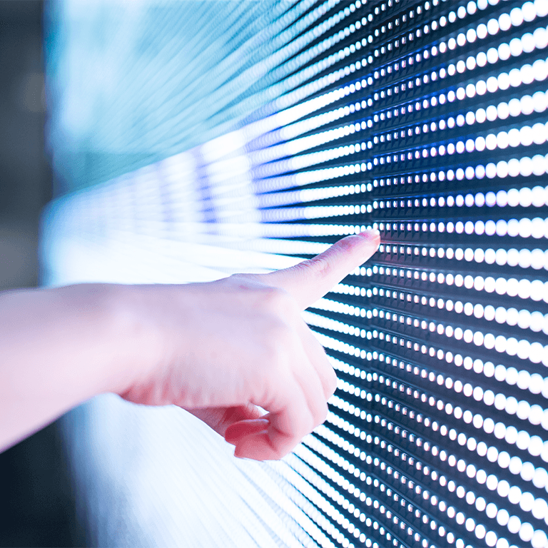 Hand pointing to lights on a screen