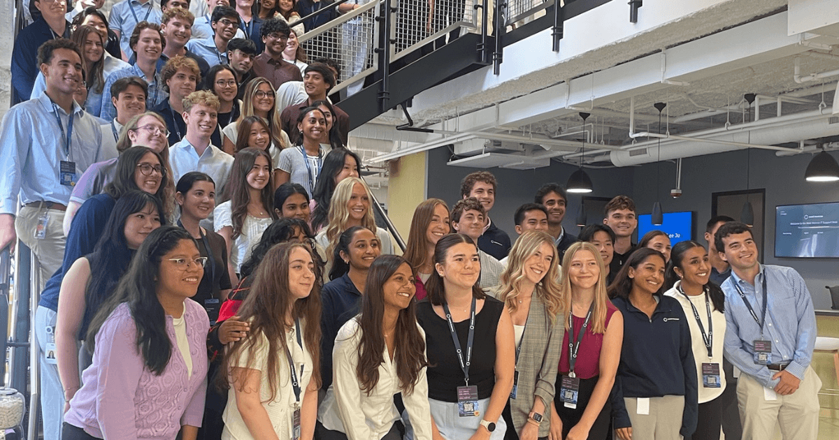 west monroe 2026 intern class standing on the steps in the west monroe chicago office