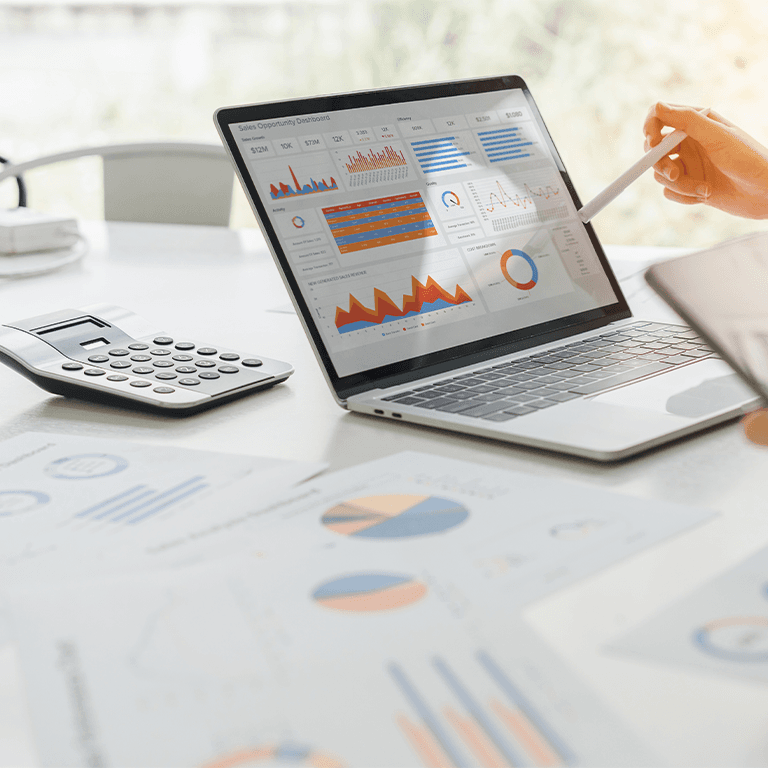 a laptop with charts displayed